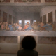 A woman studying Leonardo da Vinci’s painting, The Last Supper.